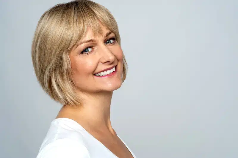 Blonde woman representing natural looking facial rejuvenation